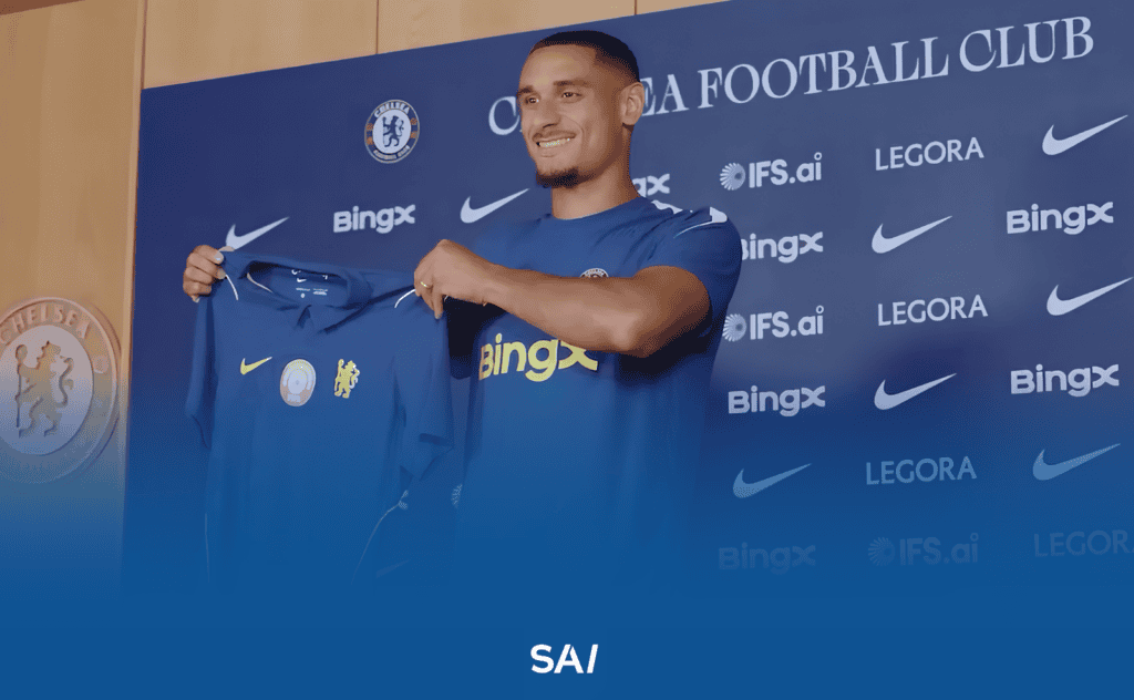 Maxence Lacroix holds up his Chelsea shirt after his transfer on 30 July 2026. The France international defender, represented by Unique Sports Group, joined the London club from Crystal Palace for a fee estimated at around £51 million, on a six-season contract.